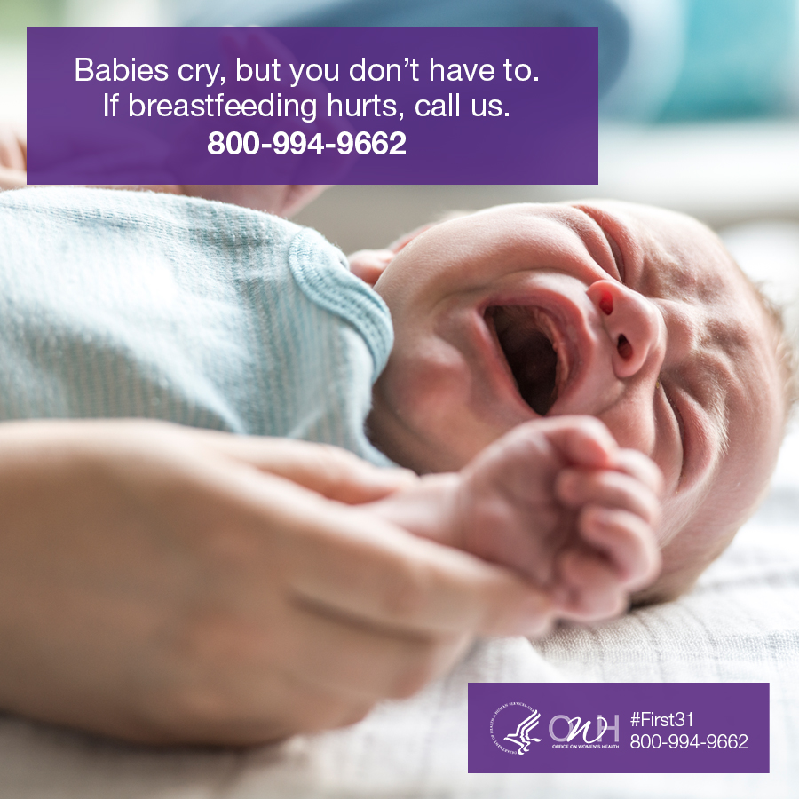 A crying infant held gently by an adult hand, with a message about breastfeeding support and a contact number displayed.